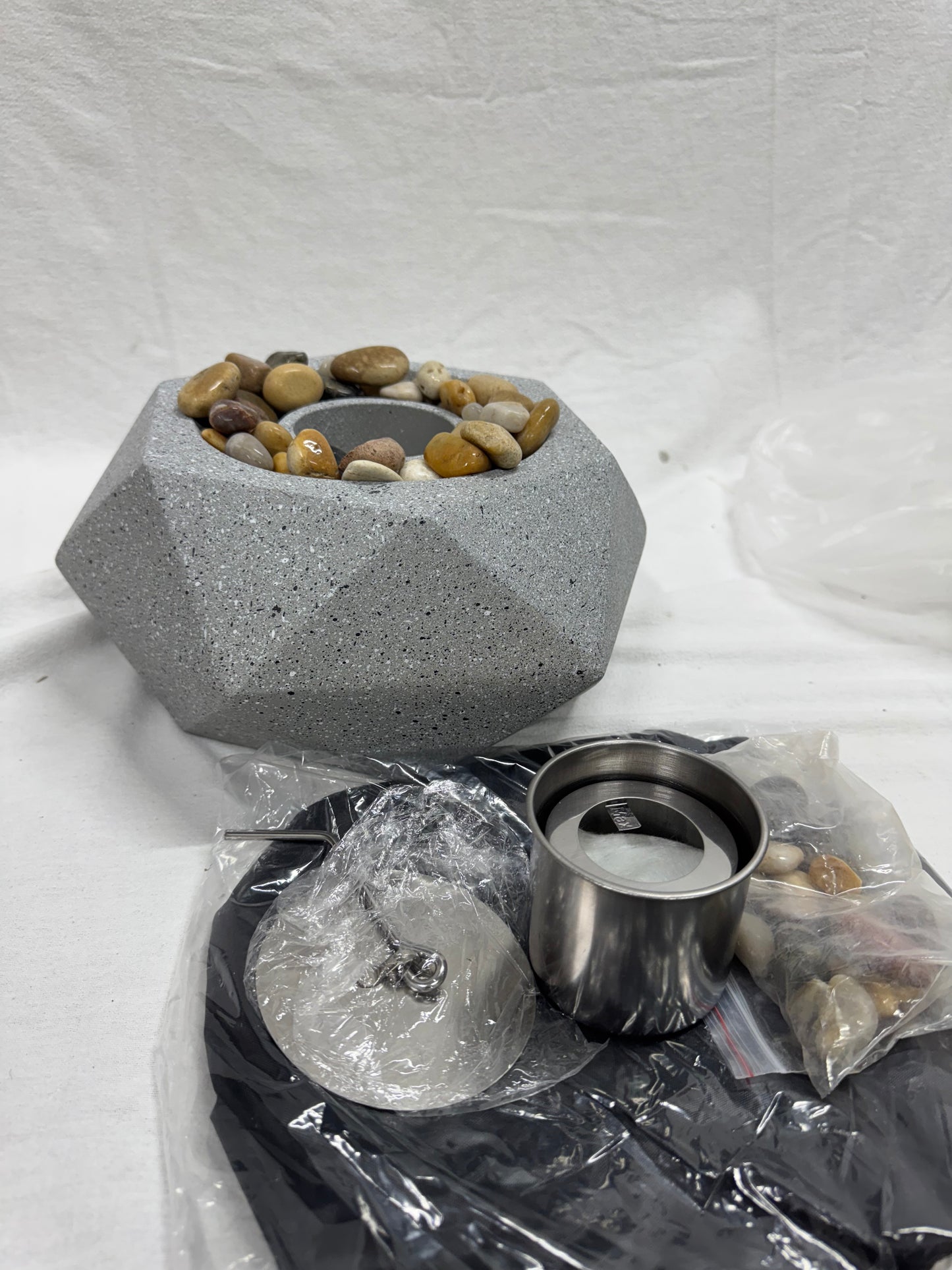 Brand new in box.  Modern Geometric Fire Pit.